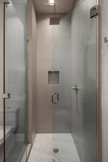 a bathroom with a sink and shower