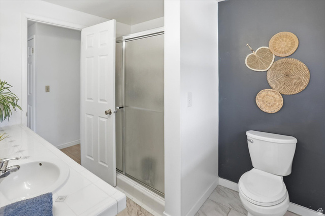 5108 South 2000th Street West Roy, UT 84067 - Photo 26 of 61 Full bathroom featuring double vanity, a stall shower, and light marble finish floors