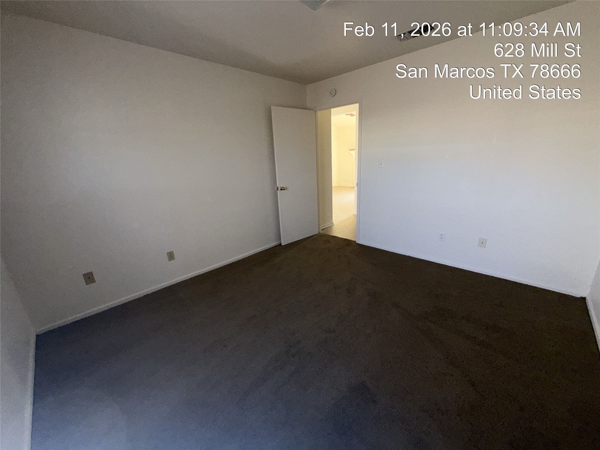 628 Mill Street, Unit B San Marcos, TX 78666 - Photo 13 of 13 Spare room featuring dark colored carpet and baseboards