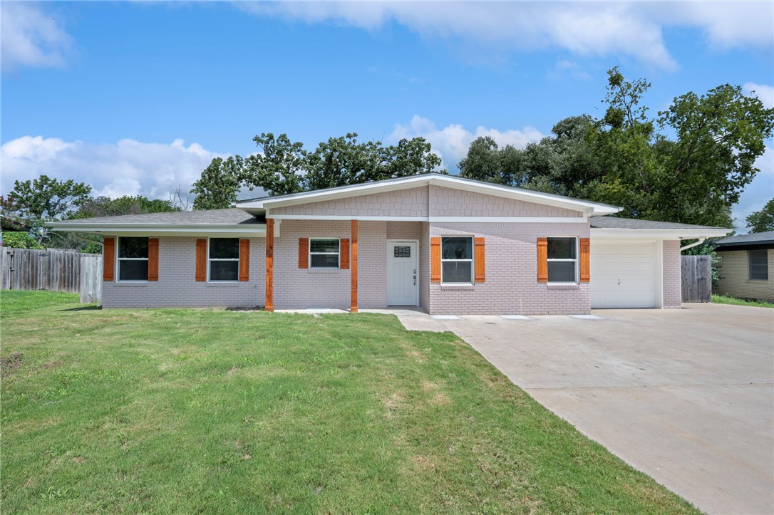 304 Dunn Street Bryan, TX 77801 - Photo 1 of 29 Single story home with concrete driveway, brick si