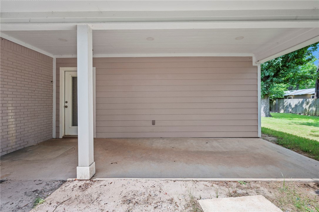 304 Dunn Street Bryan, TX 77801 - Photo 23 of 29 View of patio / terrace with an attached carport