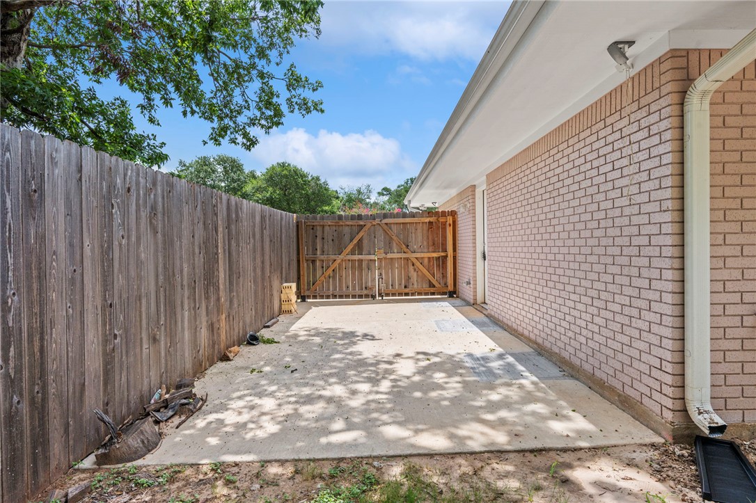 304 Dunn Street Bryan, TX 77801 - Photo 27 of 29 View of patio / terrace with a gate