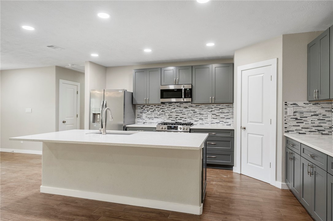 304 Dunn Street Bryan, TX 77801 - Photo 6 of 29 Kitchen with appliances with stainless steel finis
