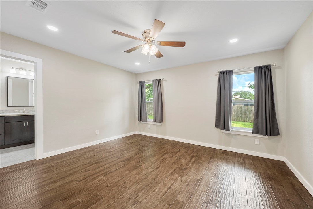 304 Dunn Street Bryan, TX 77801 - Photo 9 of 29 Primary bedroom room with healthy amount of natura