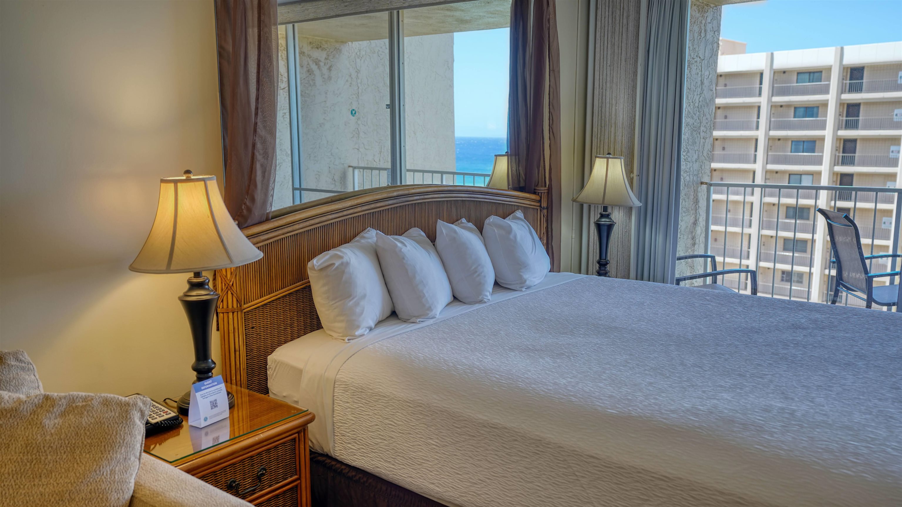 4365 Lower Honoapiilani Road, Unit 1018 Lahaina, HI 96761 - Photo 17 of 35 a bedroom with a bed and wooden floor