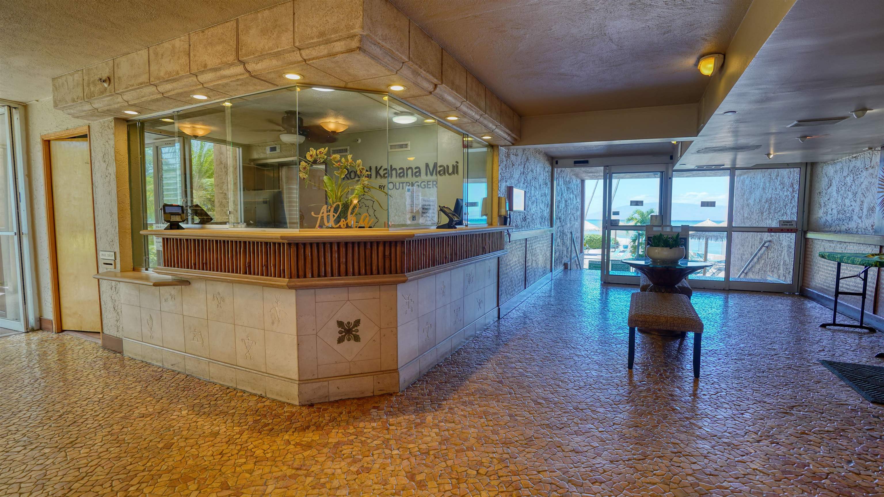 4365 Lower Honoapiilani Road, Unit 1018 Lahaina, HI 96761 - Photo 27 of 35 a living room with furniture and a fireplace