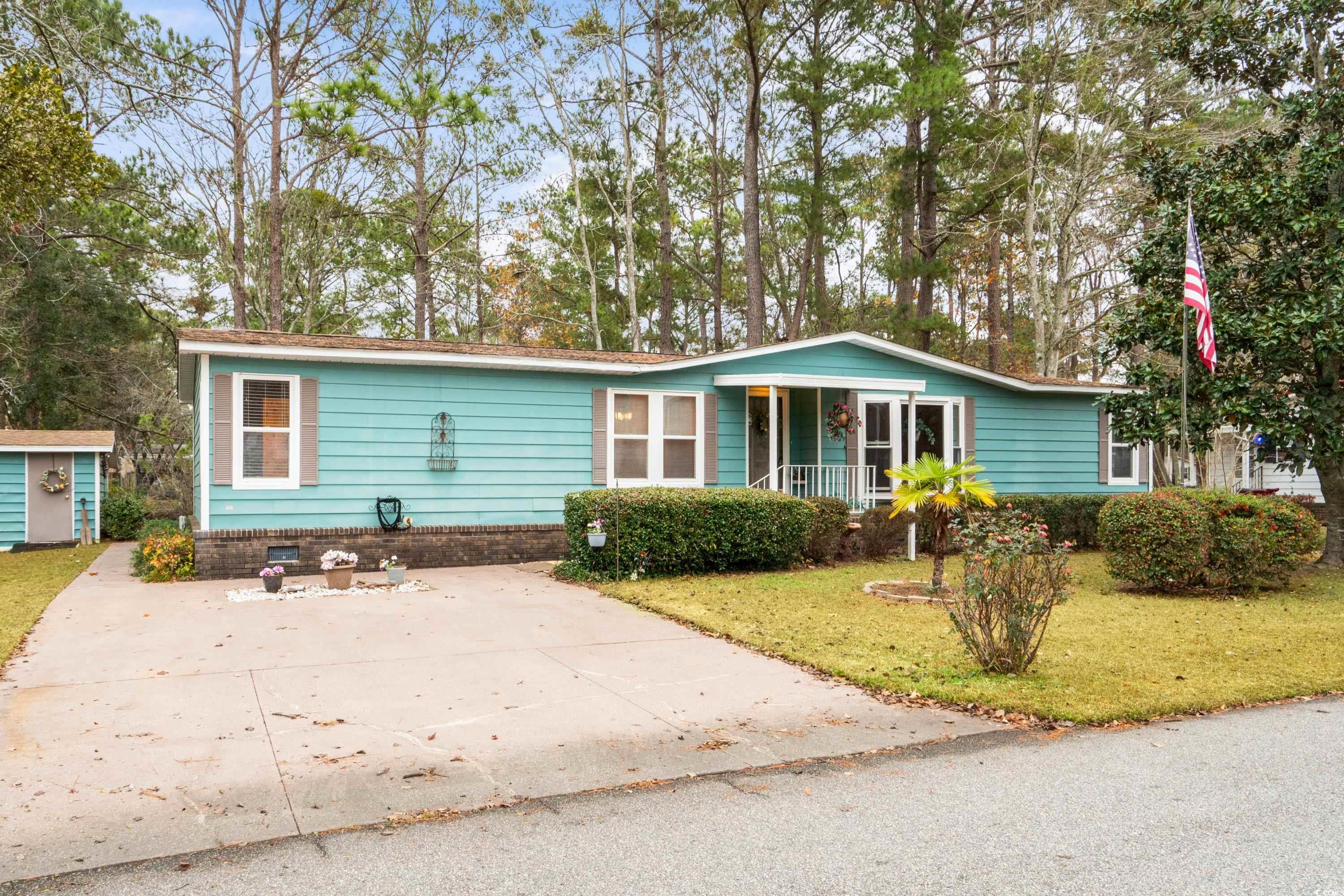 808 Carolina Drive Murrells Inlet, SC 29576 - Photo 1 of 40 Single story home with a storage unit, a porch, an