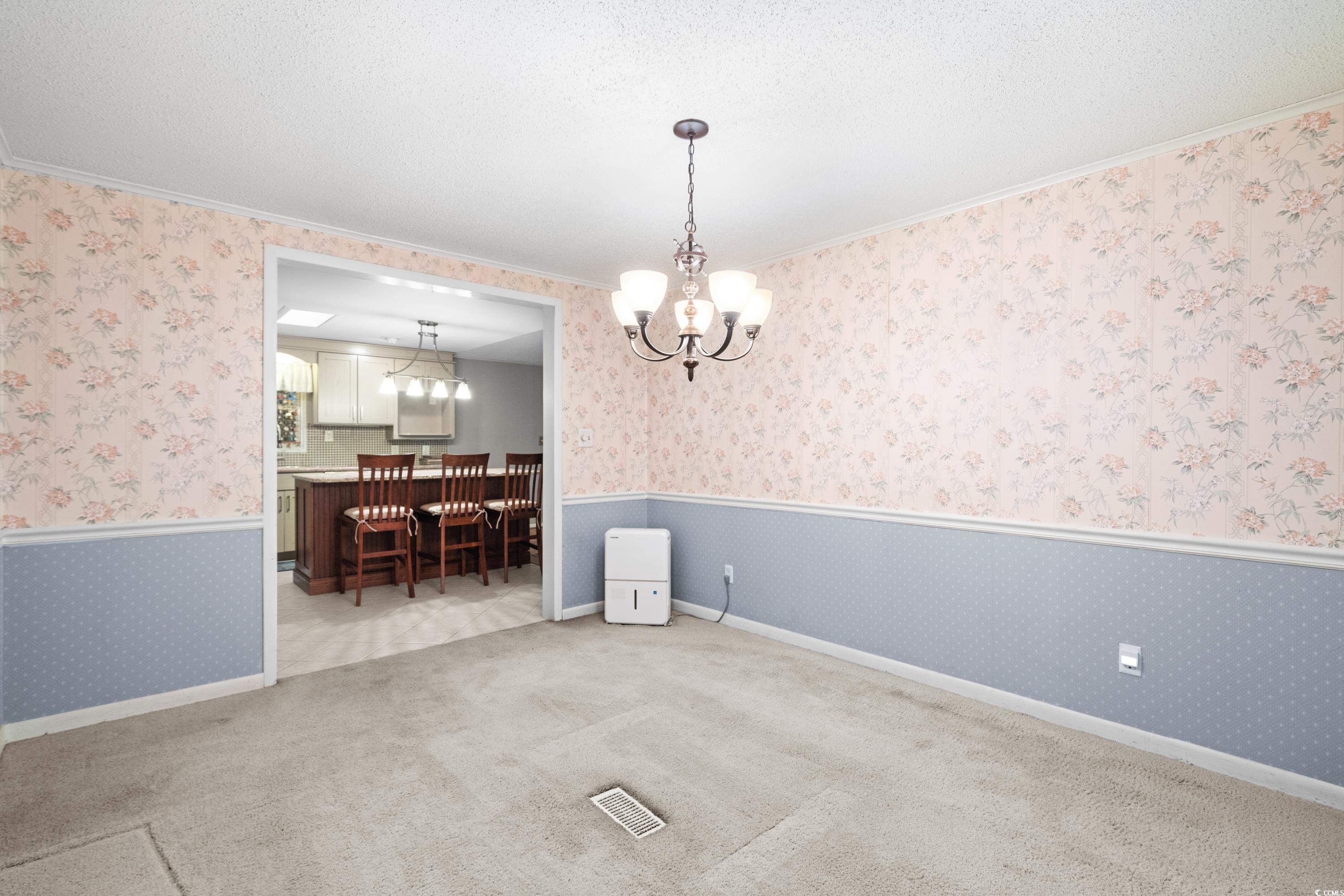 808 Carolina Drive Murrells Inlet, SC 29576 - Photo 13 of 40 Unfurnished dining area featuring an inviting chan