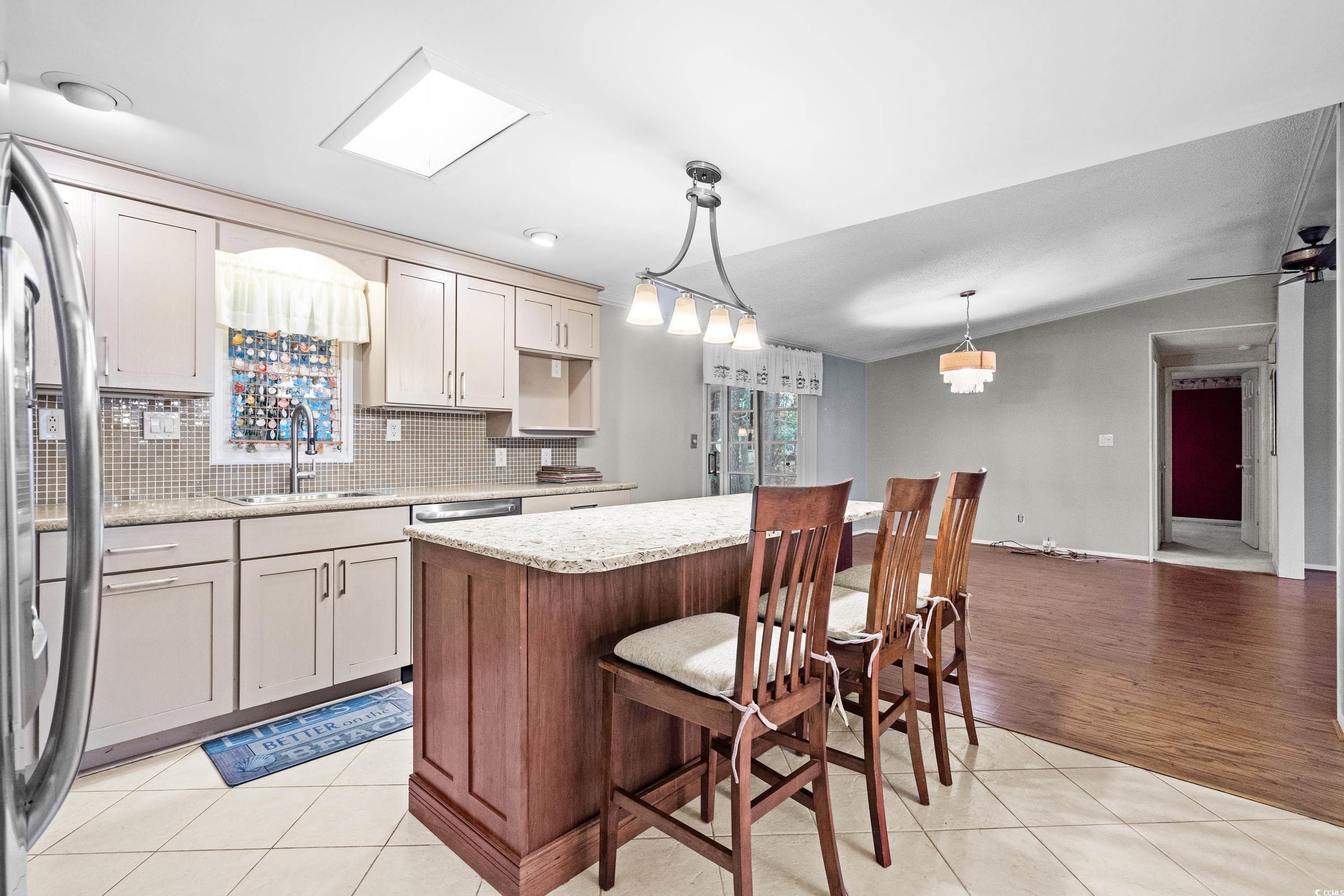 808 Carolina Drive Murrells Inlet, SC 29576 - Photo 14 of 40 Kitchen with stainless steel fridge, tasteful back