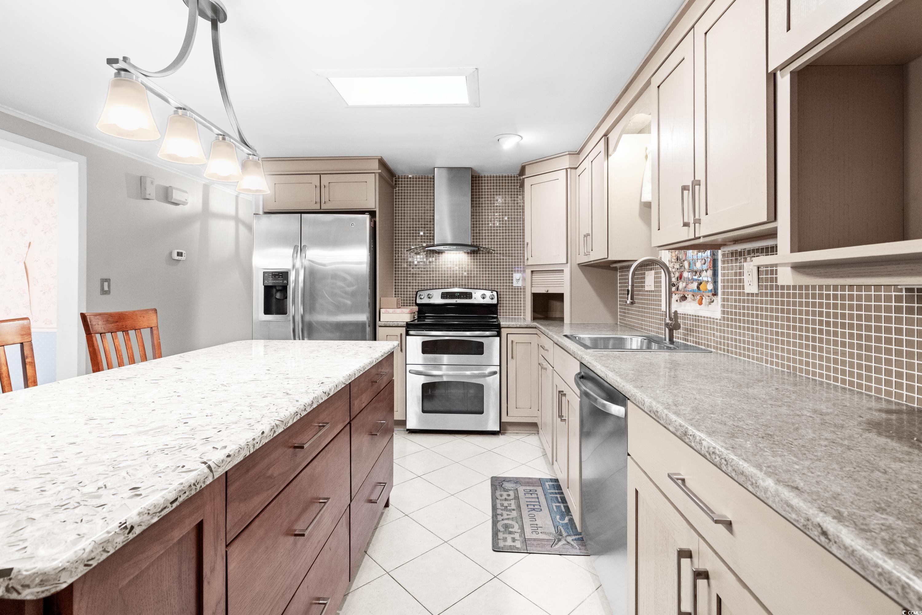 808 Carolina Drive Murrells Inlet, SC 29576 - Photo 16 of 40 Kitchen with tasteful backsplash, sink, wall chimn