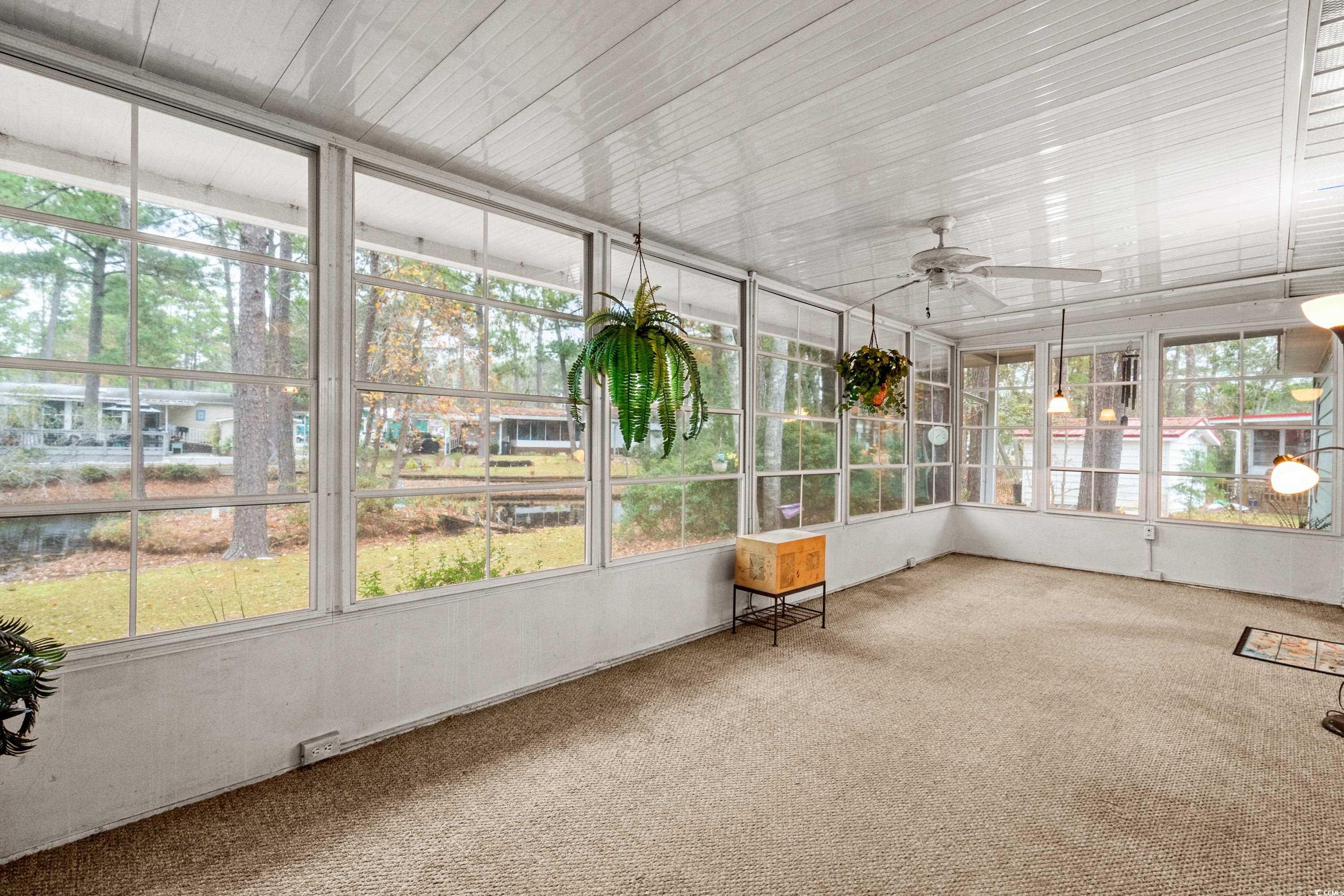 808 Carolina Drive Murrells Inlet, SC 29576 - Photo 19 of 40 Unfurnished sunroom with a wealth of natural light