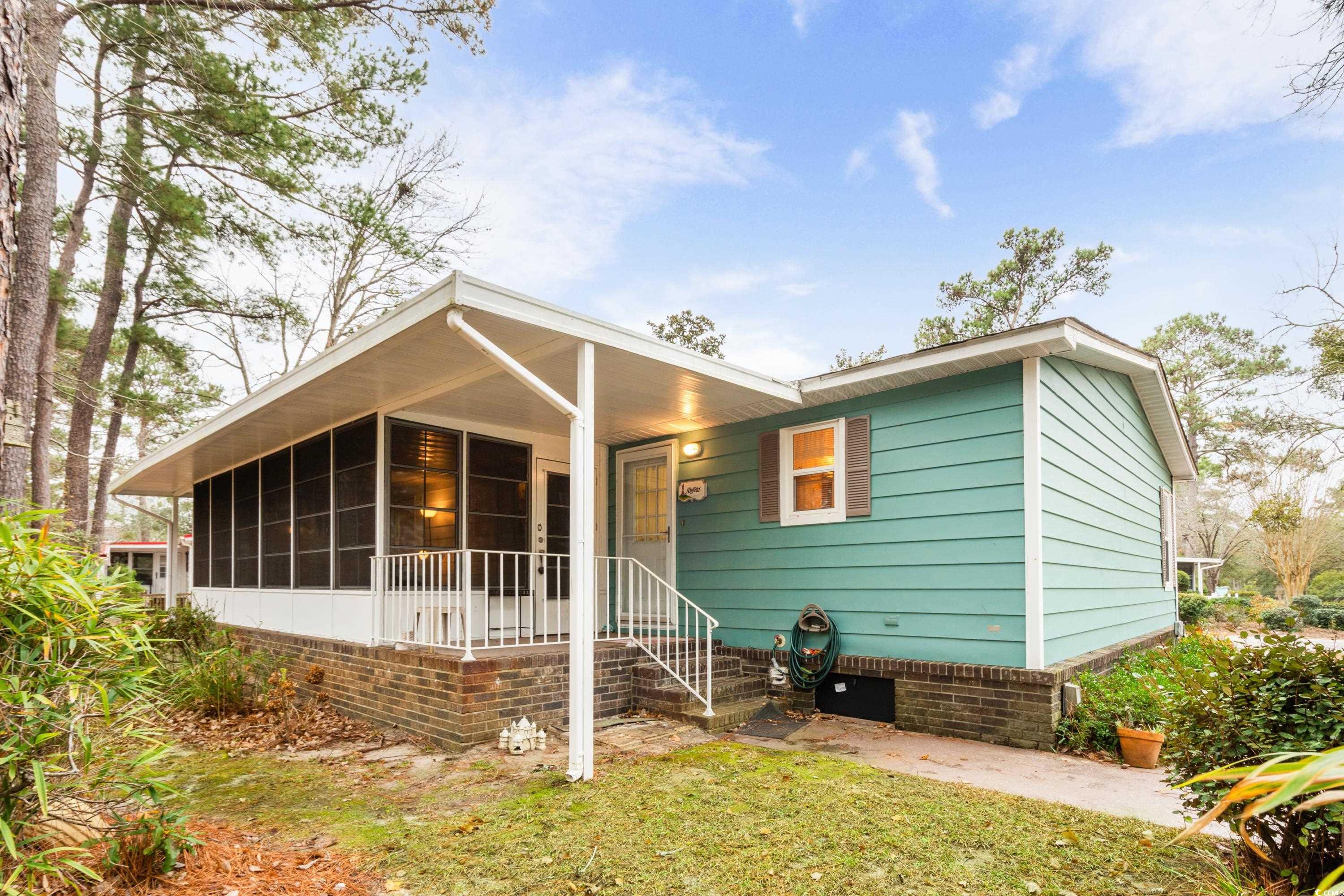 808 Carolina Drive Murrells Inlet, SC 29576 - Photo 21 of 40 View of rear porch and sun room.