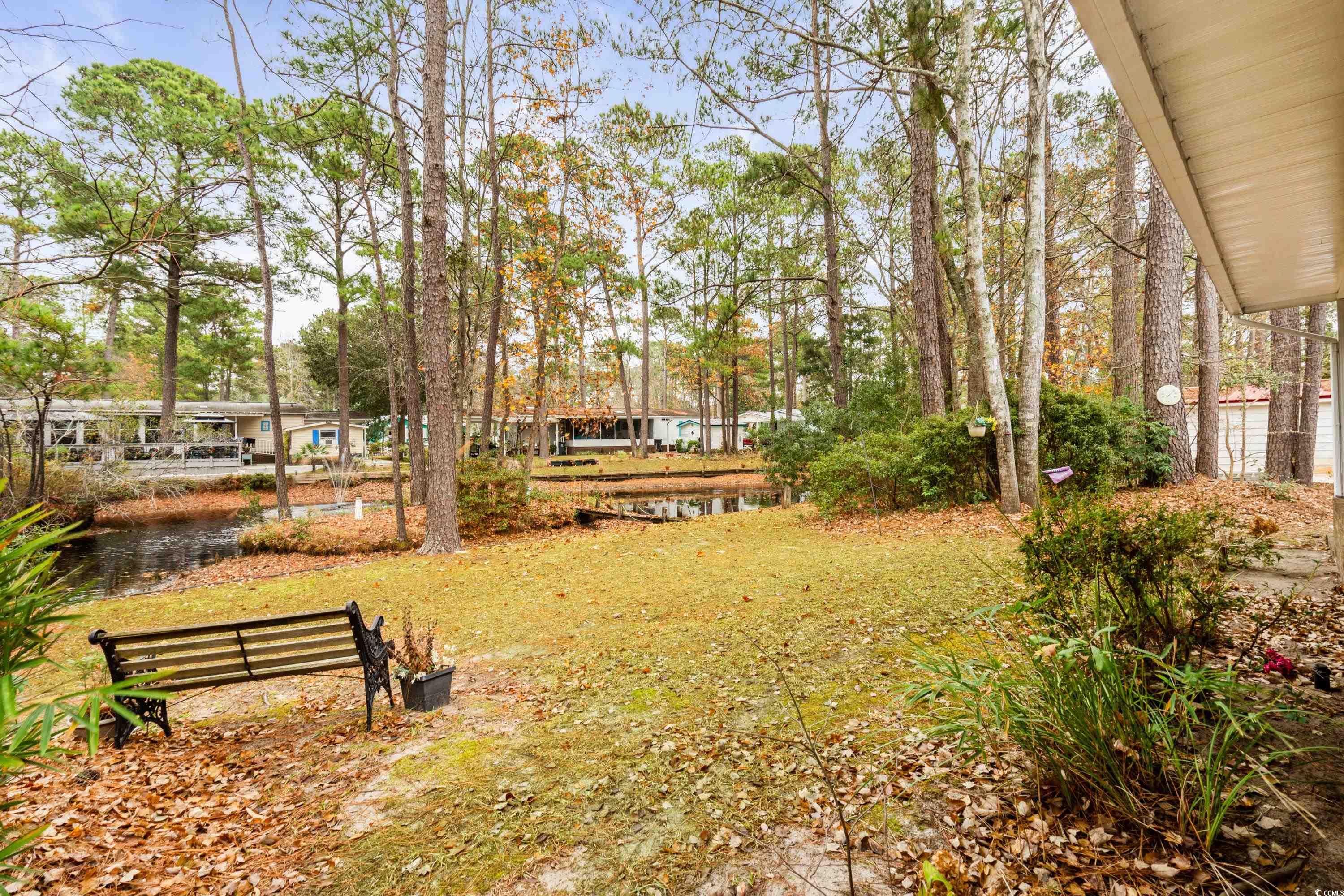 808 Carolina Drive Murrells Inlet, SC 29576 - Photo 22 of 40 View of yard with a water view