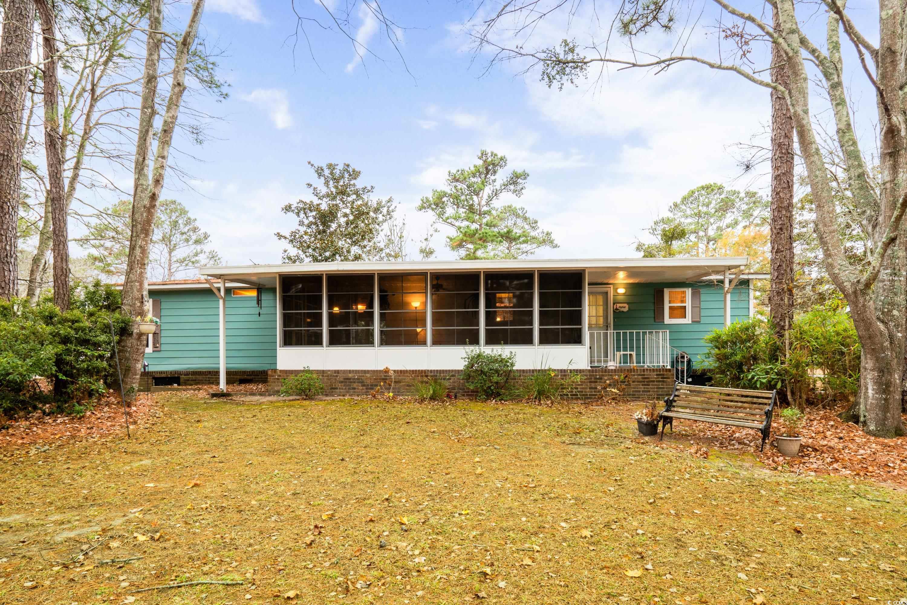 808 Carolina Drive Murrells Inlet, SC 29576 - Photo 25 of 40 Back of house featuring a sunroom