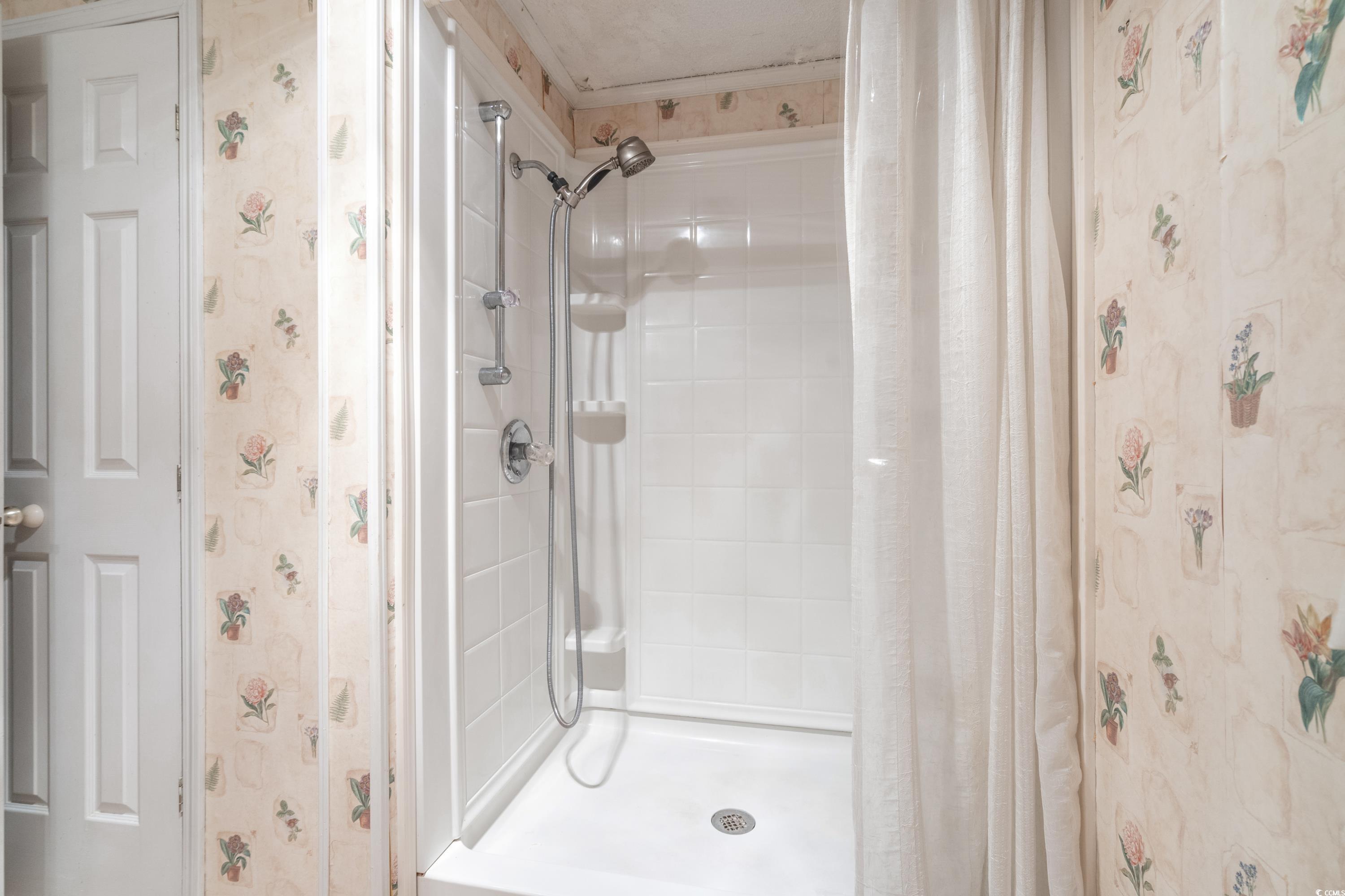 808 Carolina Drive Murrells Inlet, SC 29576 - Photo 30 of 40 Bathroom with a shower with shower curtain and orn