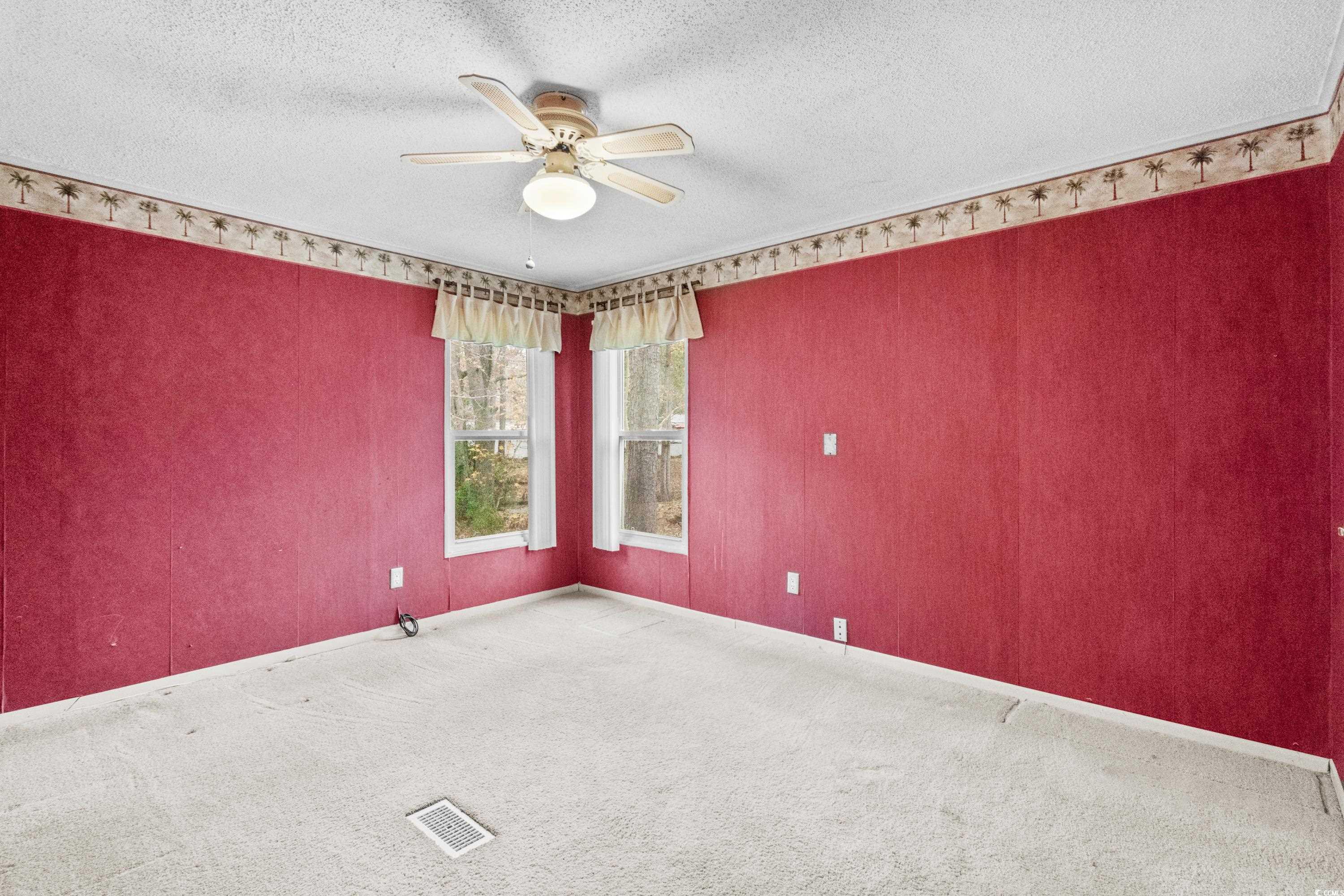 808 Carolina Drive Murrells Inlet, SC 29576 - Photo 31 of 40 Carpeted empty room with ceiling fan and a texture