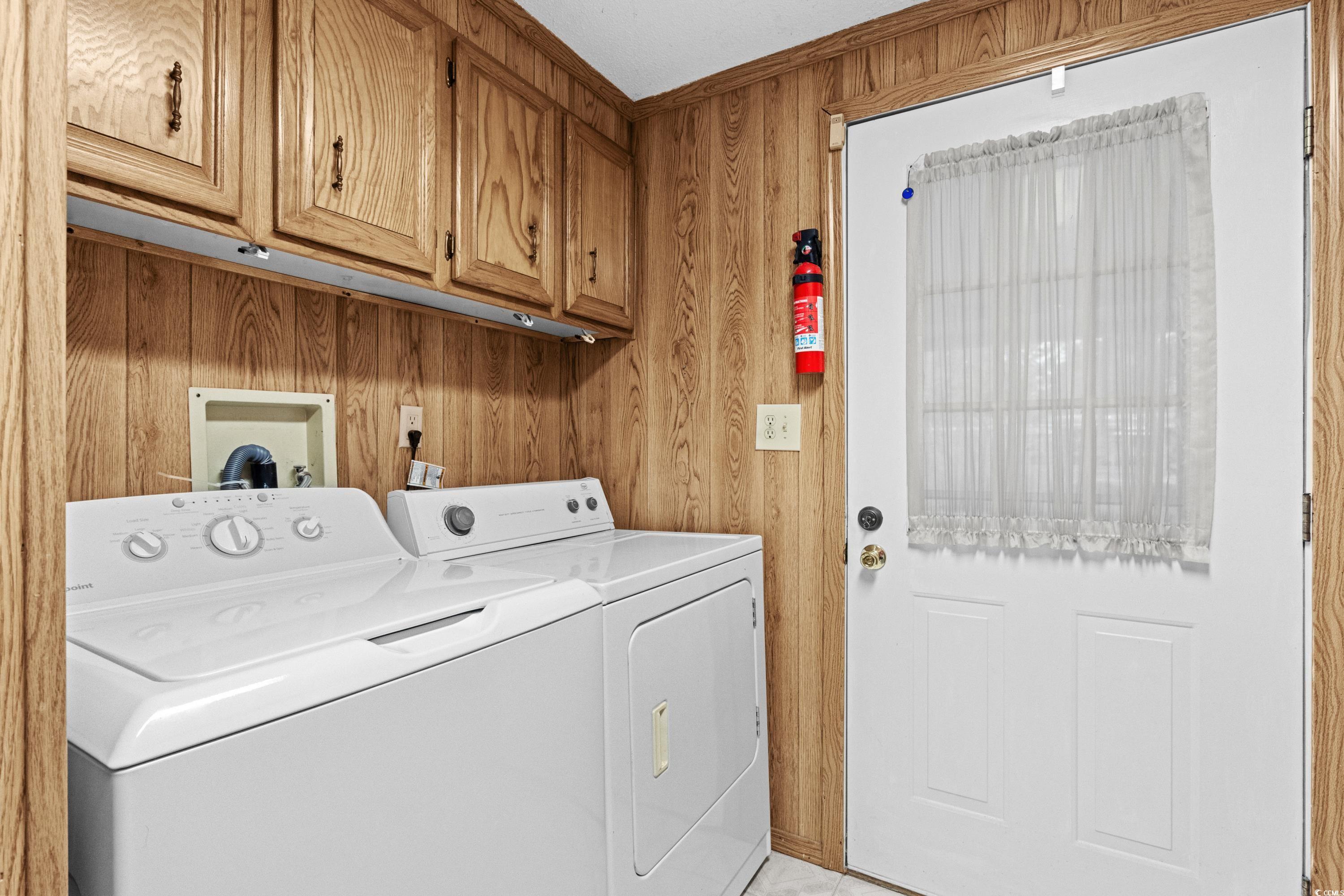 808 Carolina Drive Murrells Inlet, SC 29576 - Photo 34 of 40 Laundry area with wood walls, cabinets, and washin