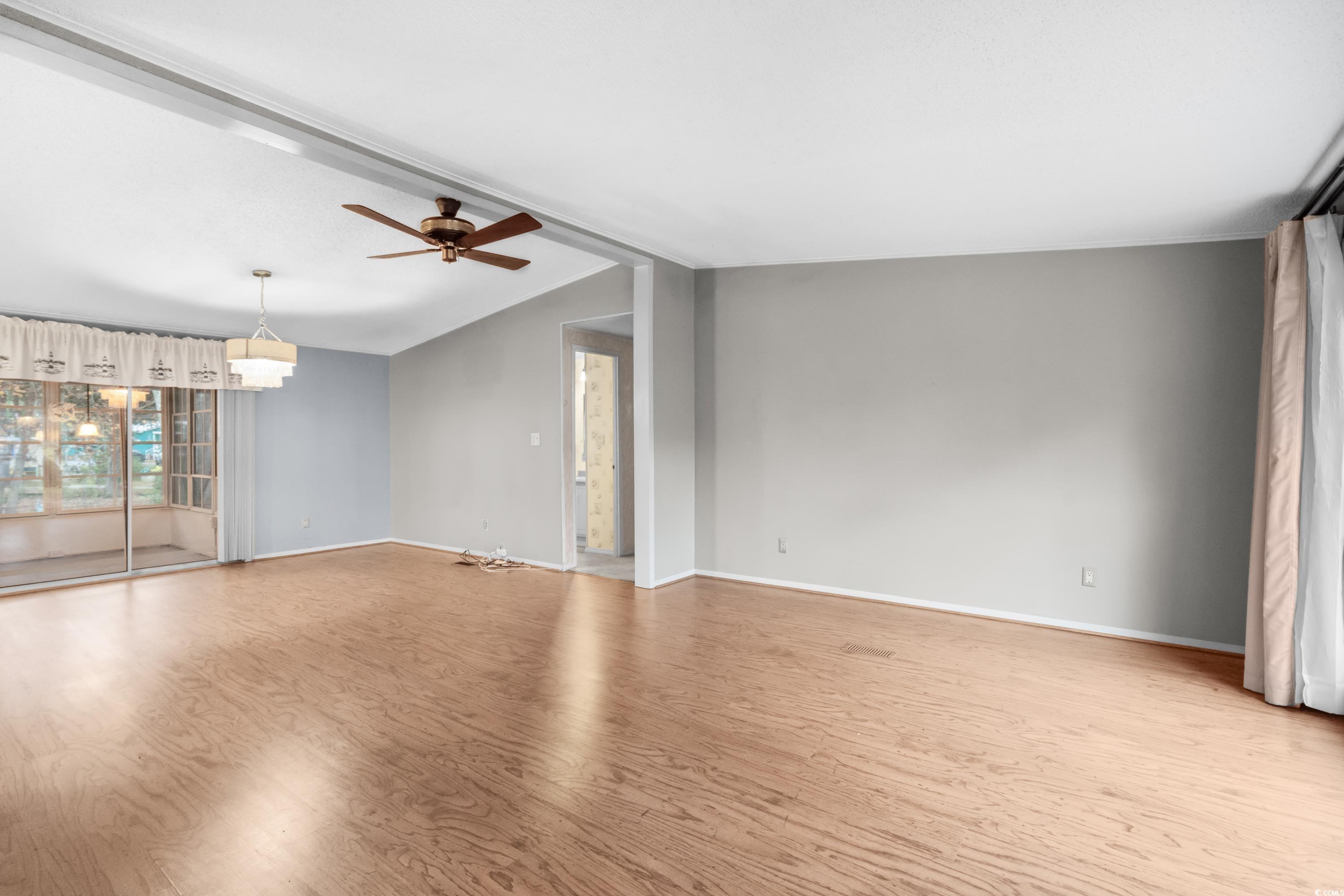808 Carolina Drive Murrells Inlet, SC 29576 - Photo 4 of 40 Spare room featuring light wood-type flooring, lof