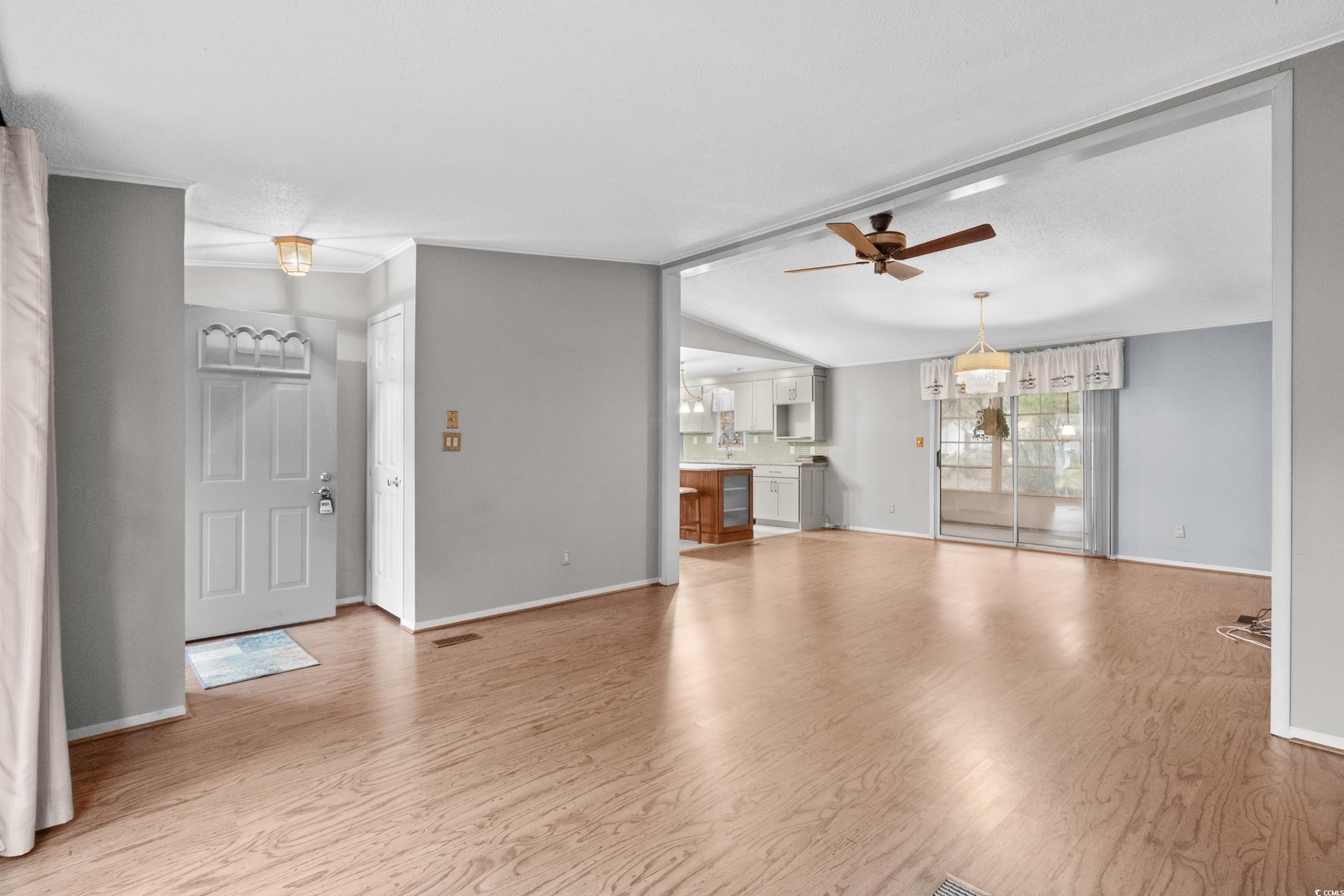 808 Carolina Drive Murrells Inlet, SC 29576 - Photo 7 of 40 Unfurnished living room featuring ceiling fan, lig