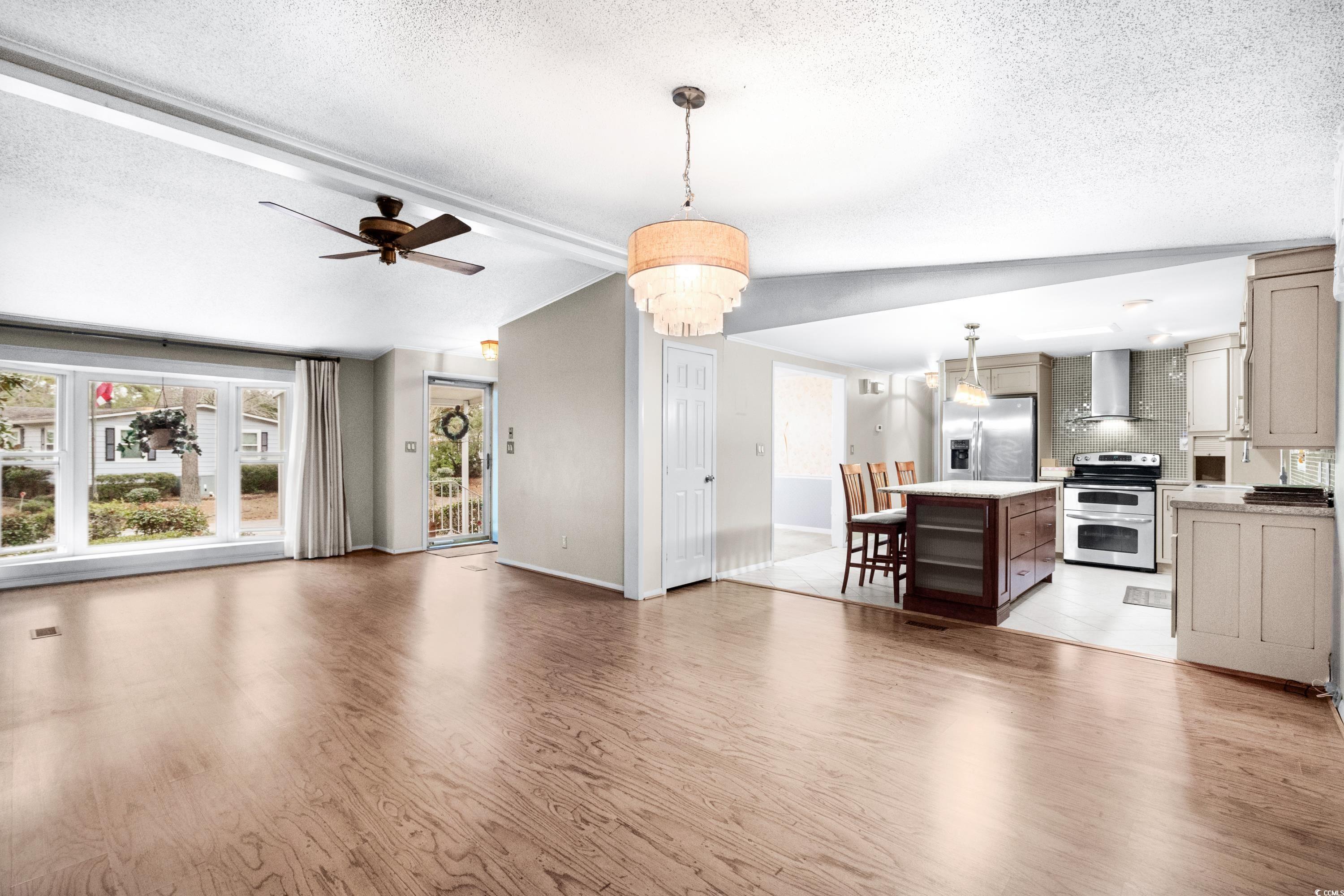 808 Carolina Drive Murrells Inlet, SC 29576 - Photo 10 of 40 Living room featuring vaulted ceiling with beams,