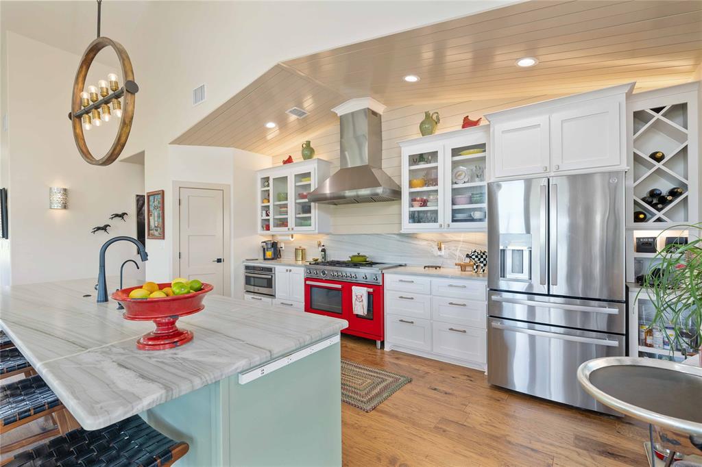 1010 Fm 583 Street West Rising Star, TX 76471 - Photo 22 of 40 a kitchen with stainless steel appliances granite countertop a sink dishwasher and a refrigerator