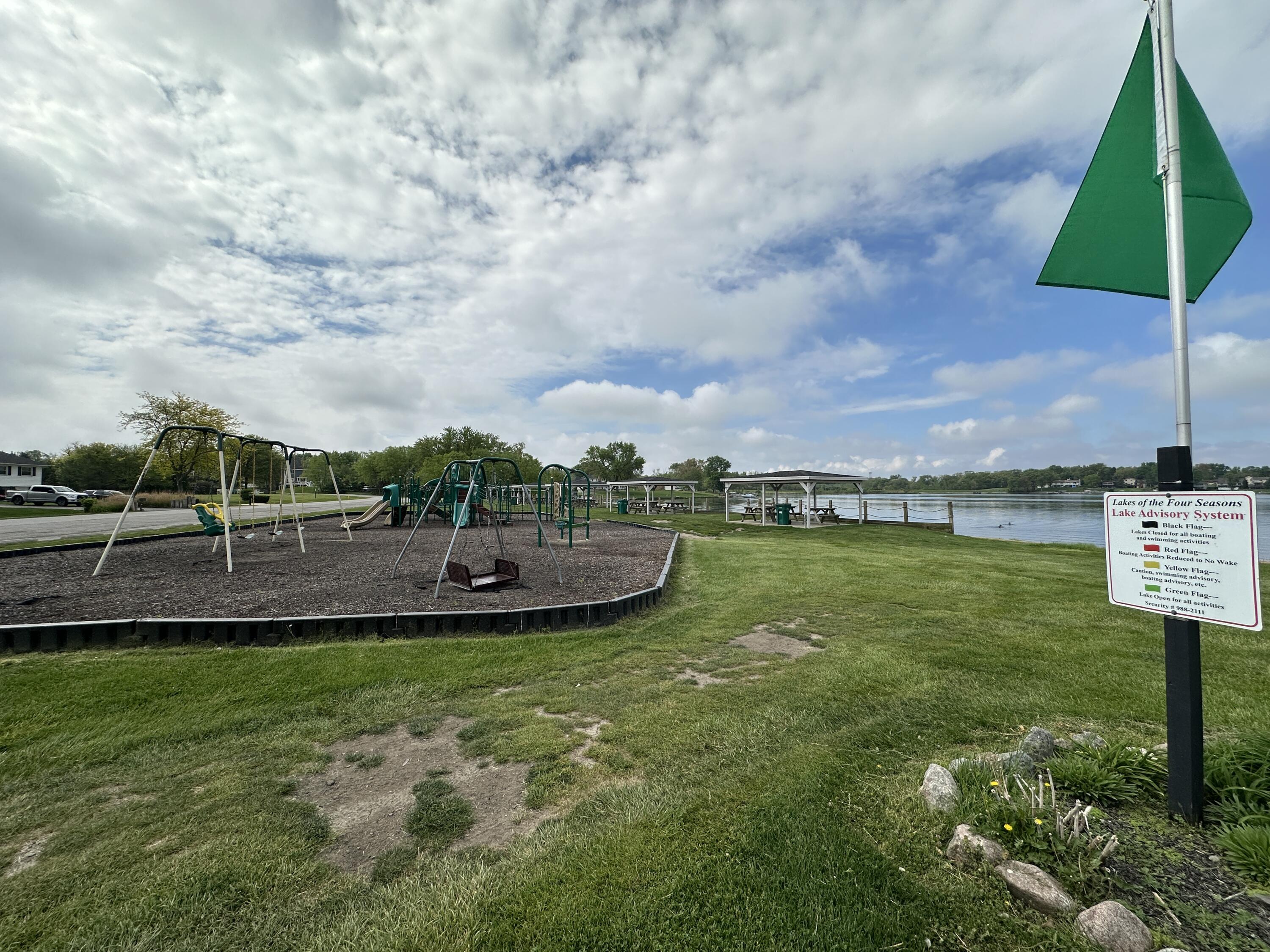 1100 Country Club Drive Crown Point, IN 46307 - Photo 16 of 24 a view of a lake with a yard