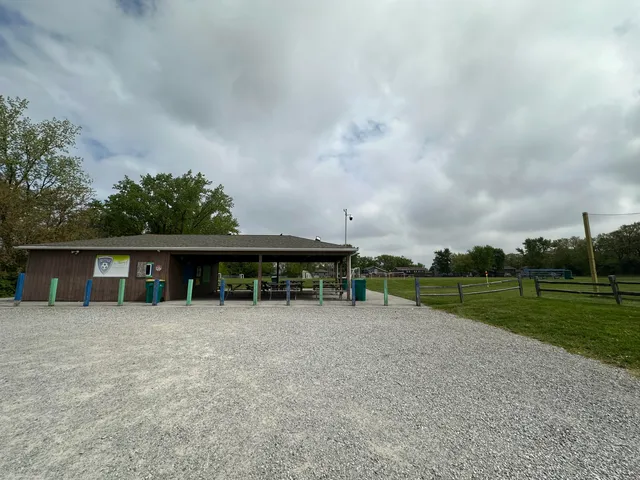 a view of a house with yard and sitting area