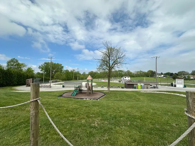 a view of a swimming pool and a yard
