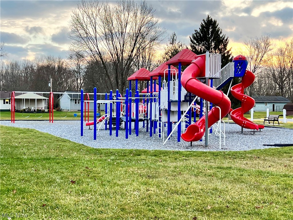 1026 Novak Road Grafton, OH 44044 - Photo 14 of 15 Playground at dusk featuring a yard