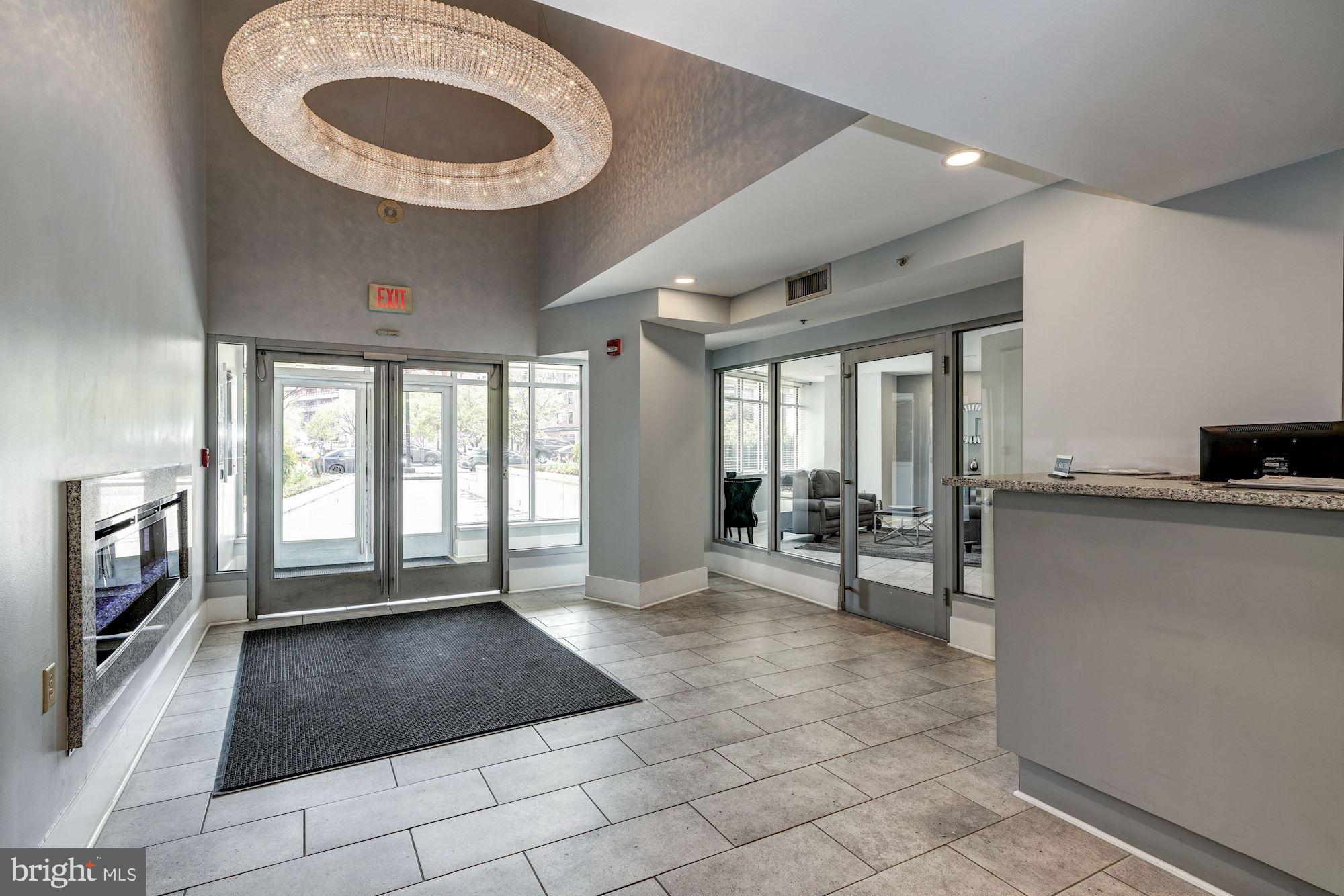 555 Massachusetts Avenue Northwest, Unit 917 Washington, DC 20001 - Photo 19 of 22 a living room with a large window and furniture