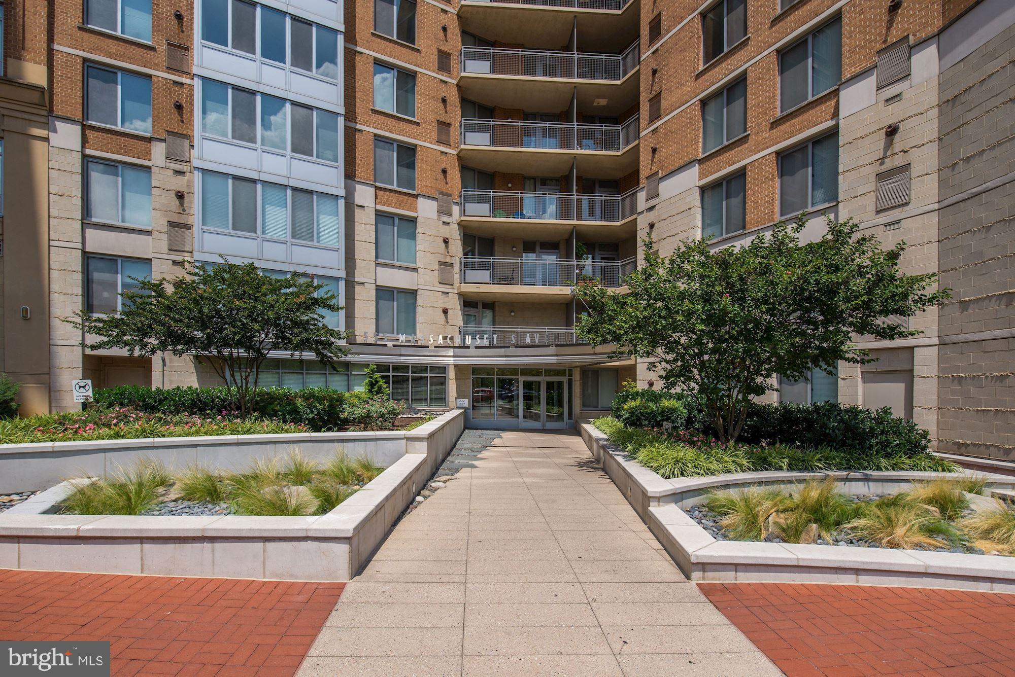 555 Massachusetts Avenue Northwest, Unit 917 Washington, DC 20001 - Photo 2 of 22 a view of a swimming pool and a chairs