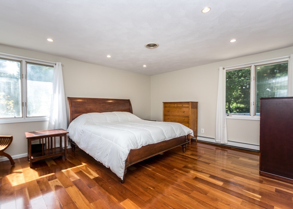51 Mary Chilton Road Needham, MA 02492 - Photo 15 of 25 a bedroom with a bed and wooden floor
