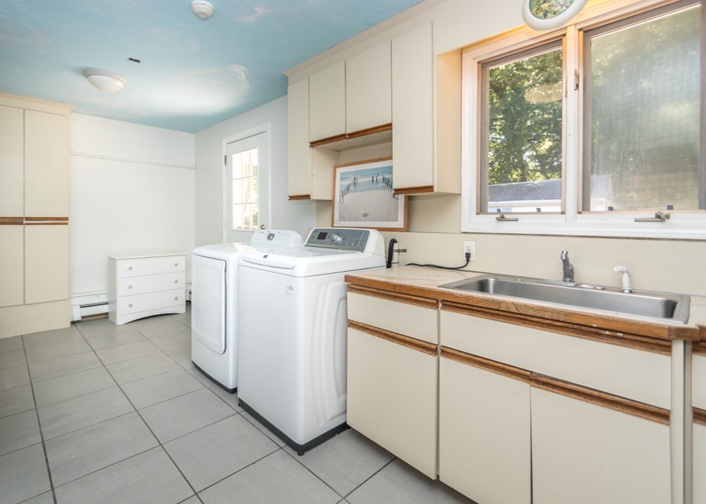 51 Mary Chilton Road Needham, MA 02492 - Photo 21 of 25 a kitchen with a sink cabinets and window