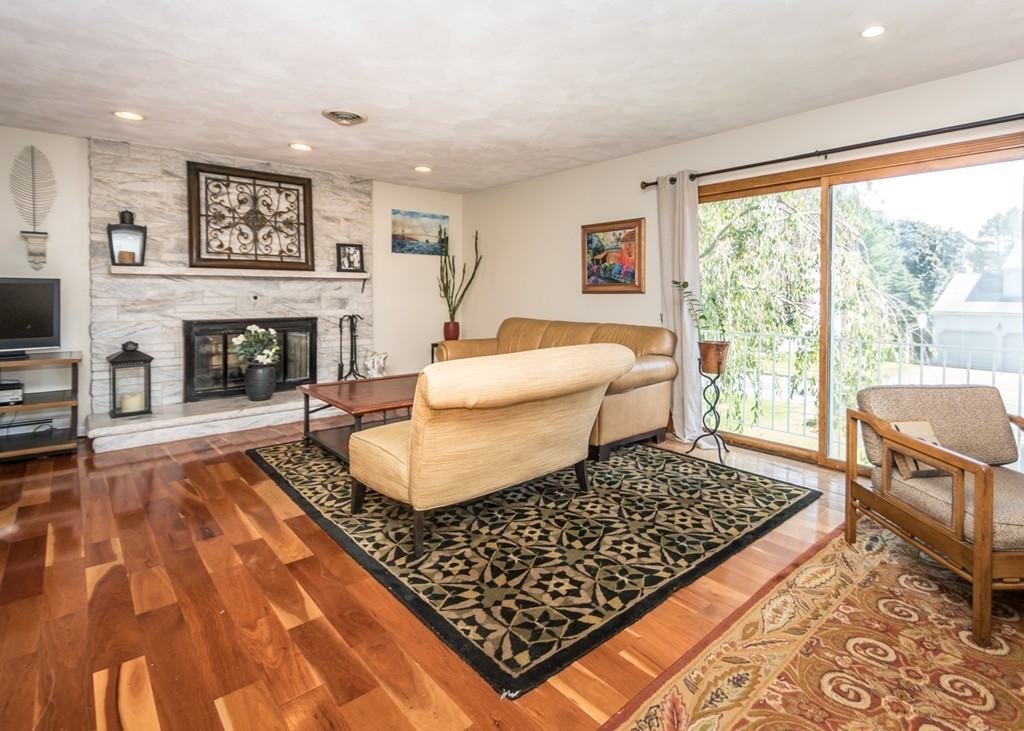 51 Mary Chilton Road Needham, MA 02492 - Photo 5 of 25 a living room with furniture and a fireplace