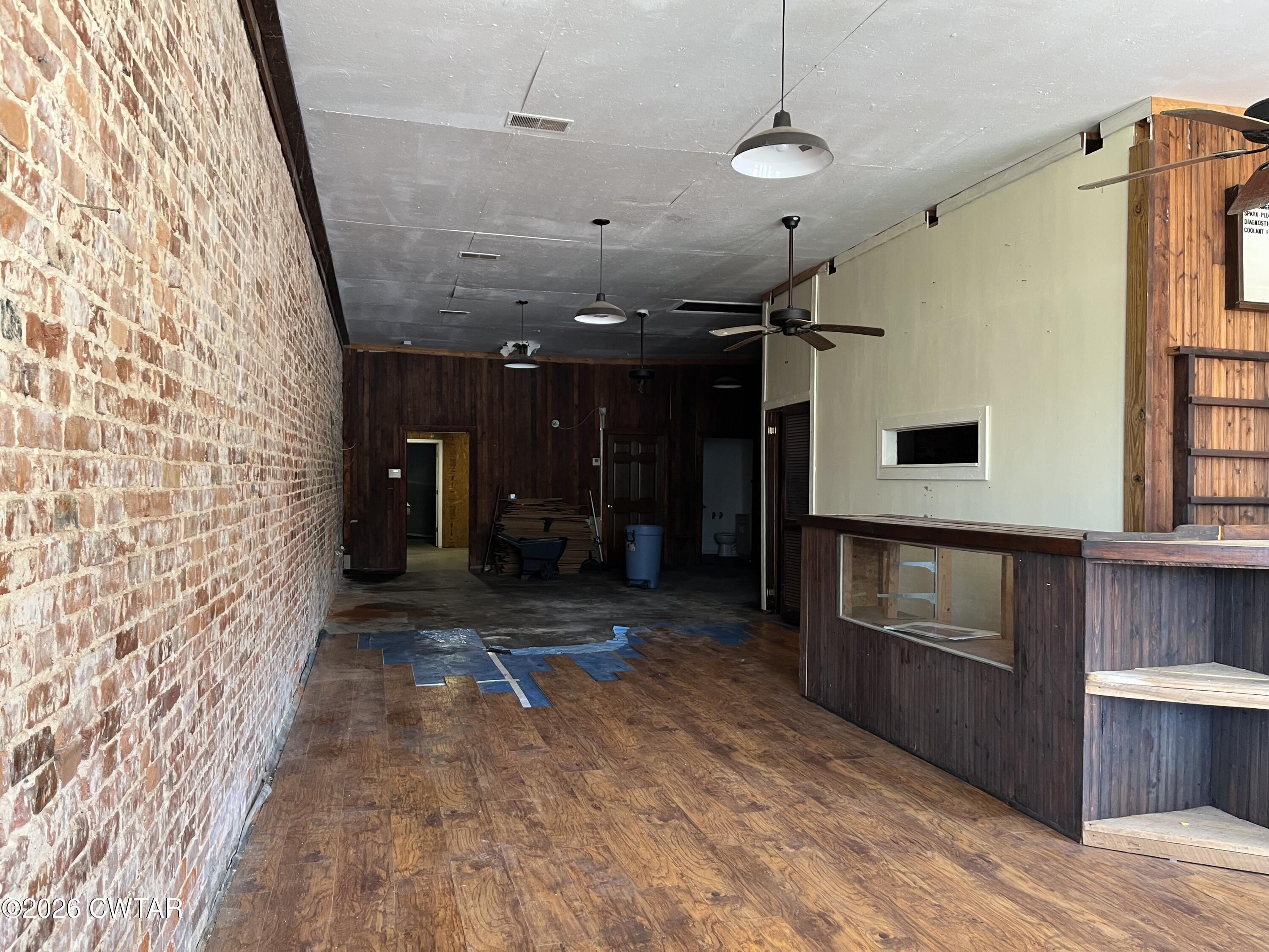 1693 Highway 138 Mercer, TN 38392 - Photo 8 of 10 a view of a hallway with wooden floor and staircase