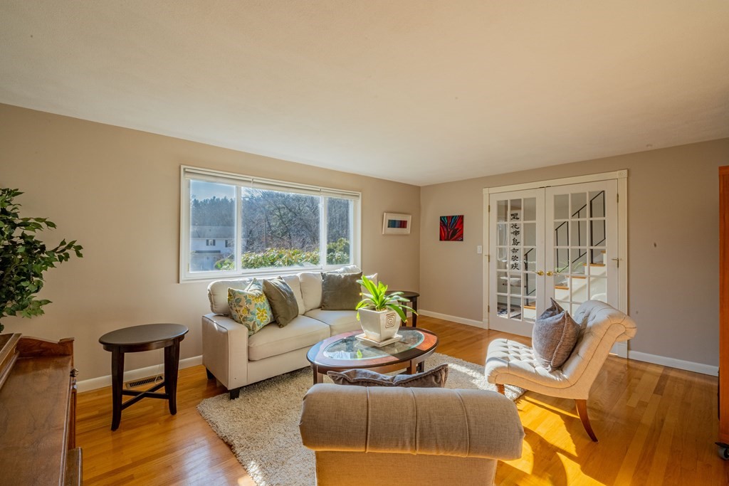 4 Springdale Road Lexington, MA 02421 - Photo 6 of 42 a living room with furniture and a large window