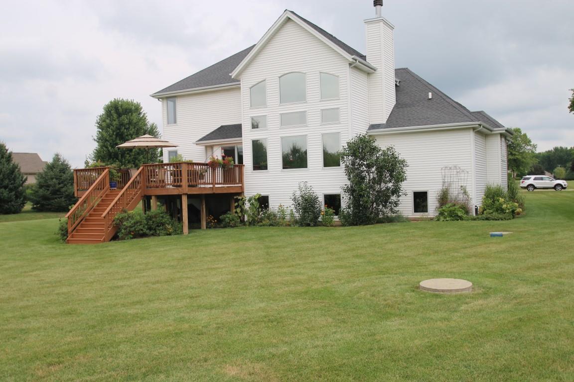 2865 Dourdan Road Belvidere, IL 61008 - Photo 23 of 24 a view of a house with a yard and sitting area