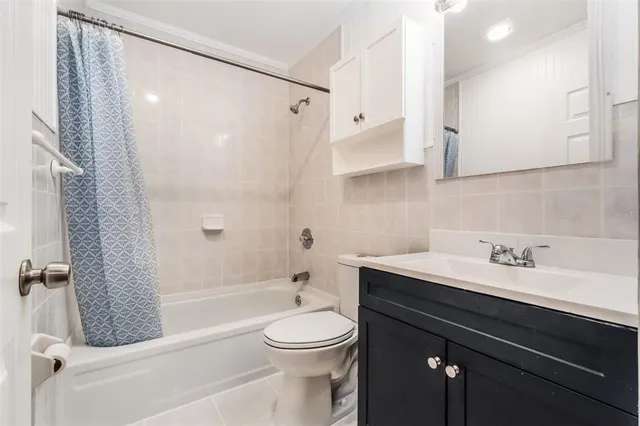 a bathroom with a sink a toilet and a bathtub