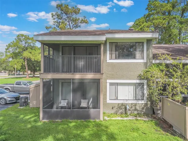a view of house with a yard