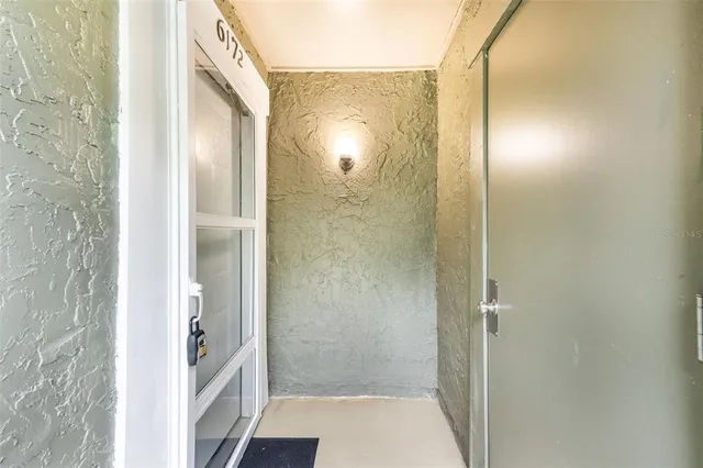 a bathroom with a glass shower door