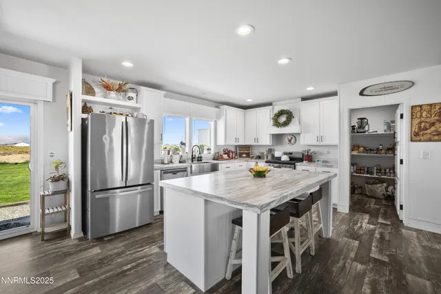 a kitchen with a sink and a refrigerator