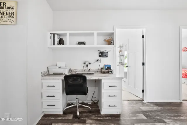 a kitchen with kitchen island a sink a stove and a refrigerator