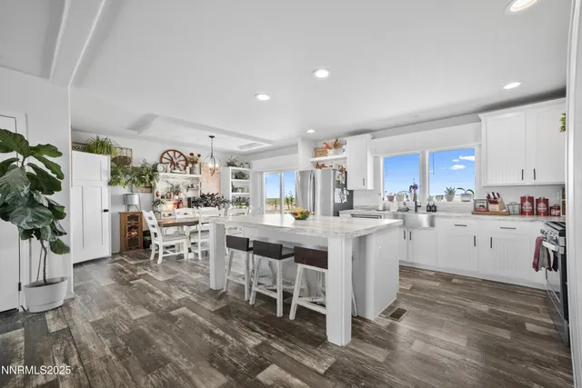 a view of living room filled with furniture and window