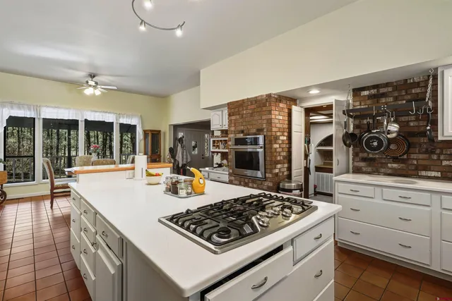 a kitchen with a sink and wooden cabinets