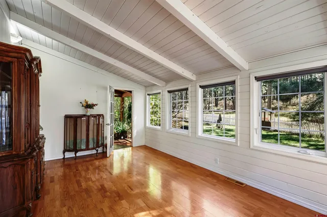 a view of a potted plant with sign on the wall