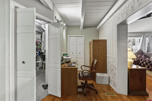 a view of entryway with wooden floor and stairs