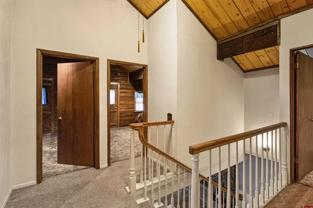 a bedroom with a bed next to a window