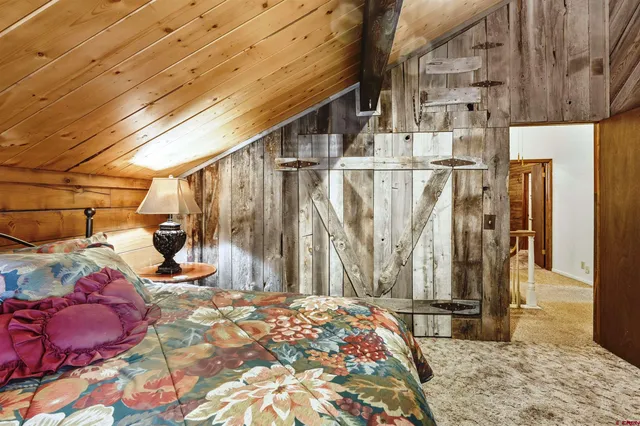 a view of a balcony with wooden floor