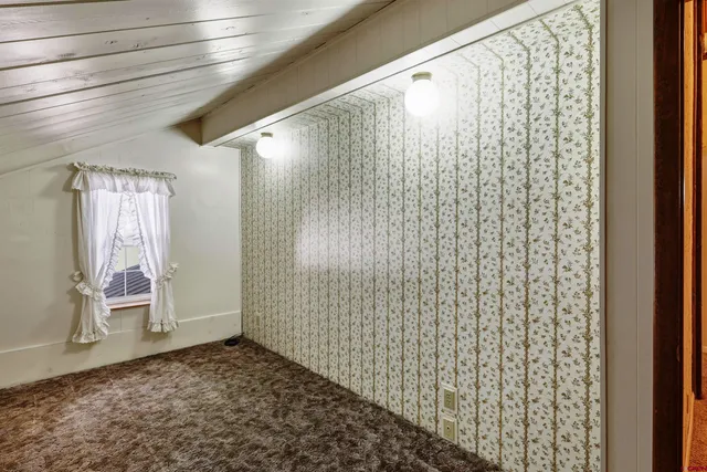 a view of a lake with outdoor seating space