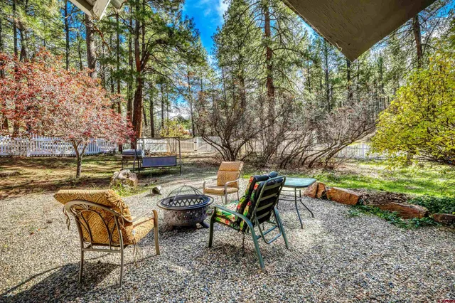 a view of a house with a yard covered with snow